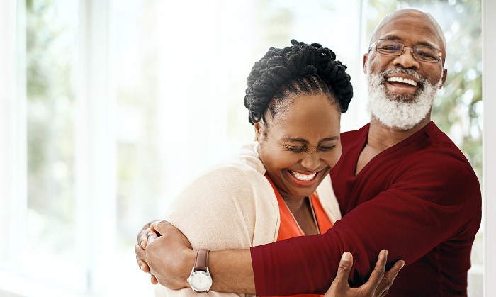 Older black couple smiling